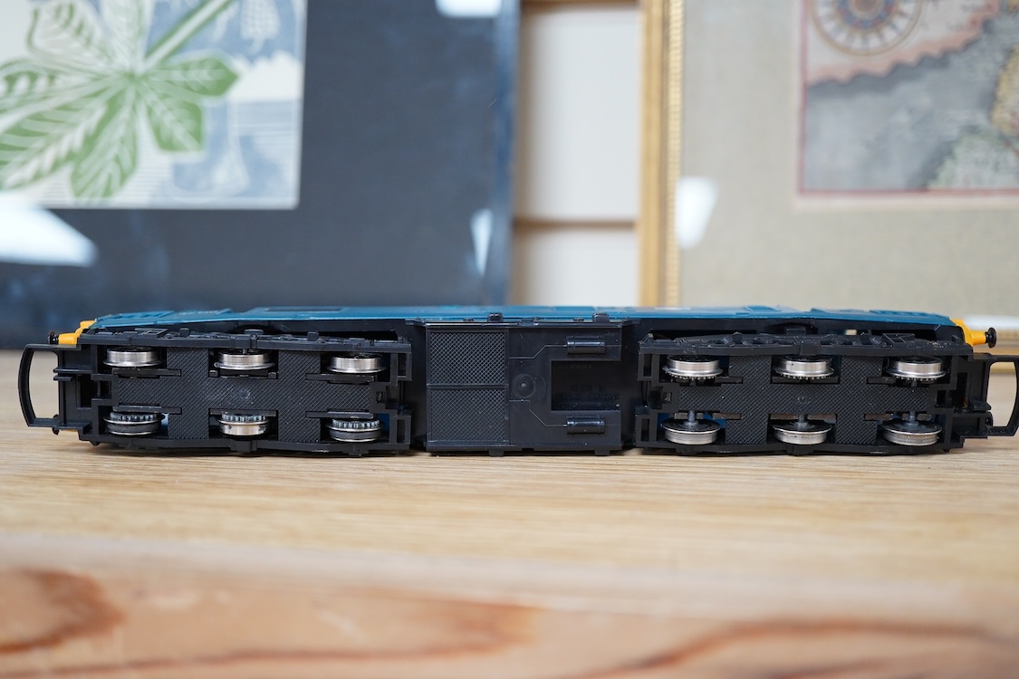 A quantity of 00 gauge model railway by Hornby, Tri-ang, etc. including nineteen locomotives in BR, GWR, LMS, etc. liveries, together with a boxed electrically operated turntable (R070), a terraced house (R8621) and a ga
